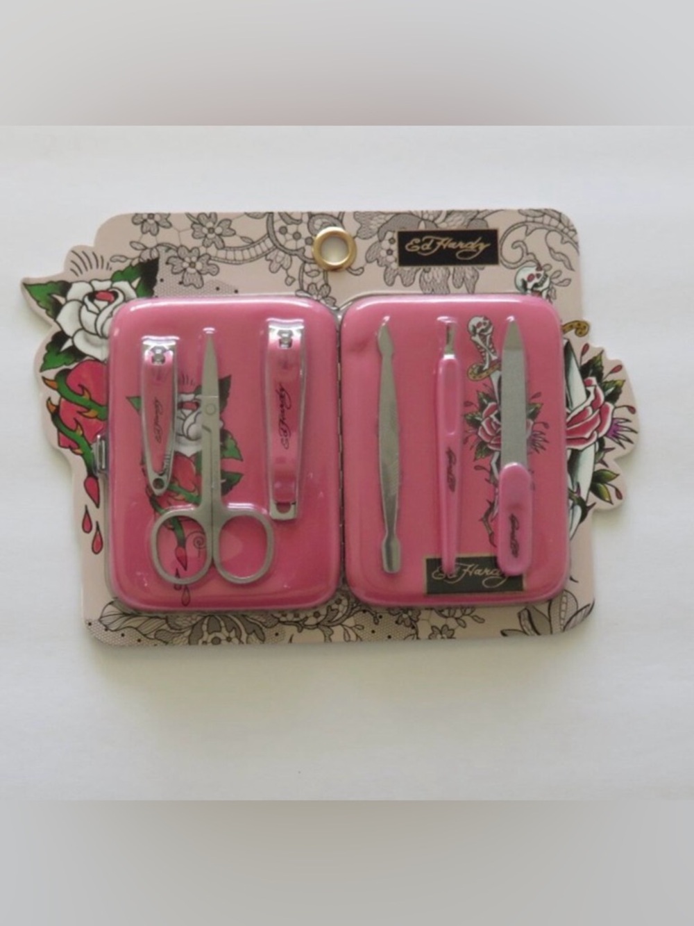 Ed Hardy Ultimate Nail Care Set. This pink 7-piece manicure and pedicure kit NWT